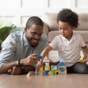 dad building blocks with his child