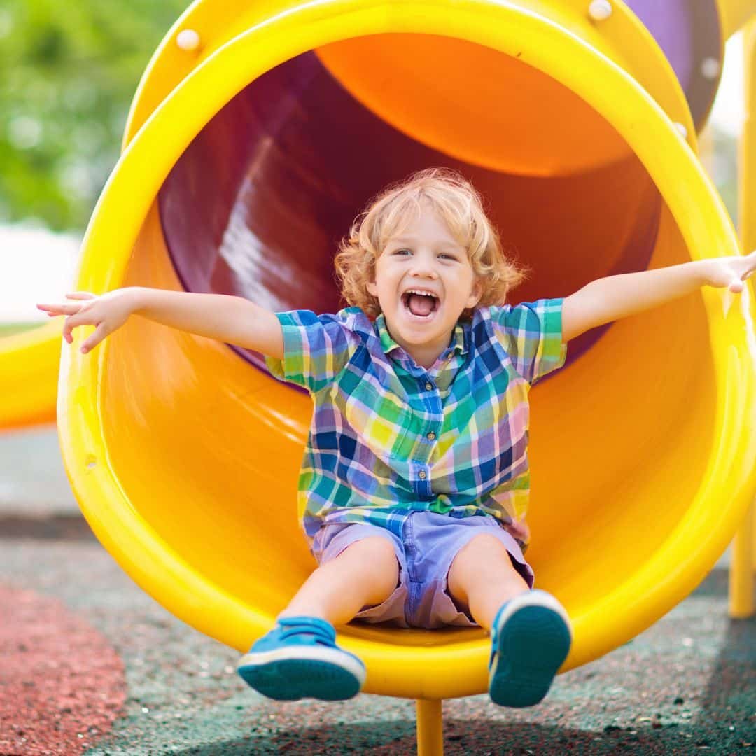 child going down a slide